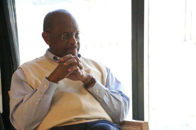 Herman Cain, GOP presidential nominee, sits down with reporters during a roundtable discussion at the Encore Hotel and Casino, Fri May 6th, 2011.